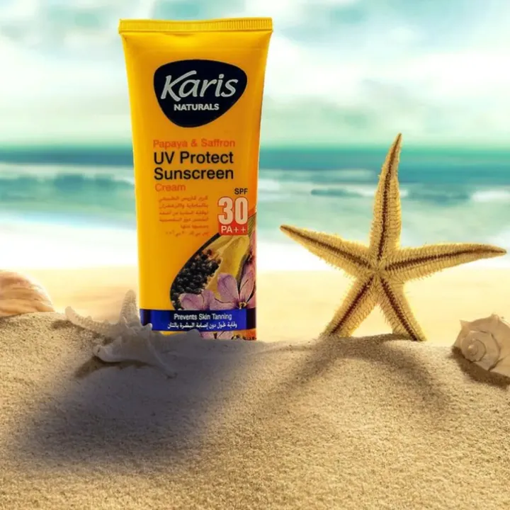 Kari’s UV protect sunscreen on a beach with a starfish
